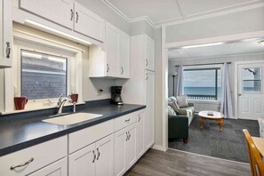Enjoy cooking and relaxing in this well-equipped kitchen with ocean views.
