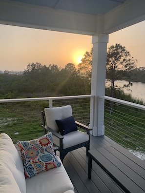 Relax in a serene outdoor space with a comfortable sofa and stunning views of the surrounding landscape.