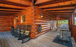 Relax on the deck with a grill at your fingertips, surrounded by rustic charm and warm ambiance.