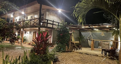 A rustic lodge surrounded by garden, nestled in a jungle setting - double Room 1