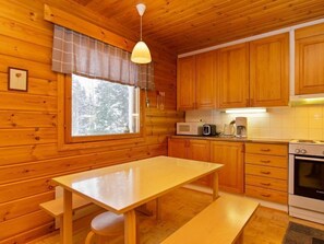 Enjoy a meal in the kitchen, which offers a microwave, coffee maker, and stove.