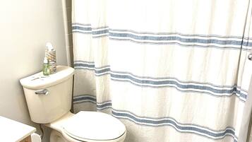 Combined shower/tub, hair dryer, towels, soap