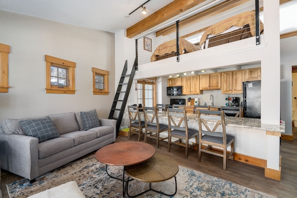 Unique kitchen island has ample seating.
