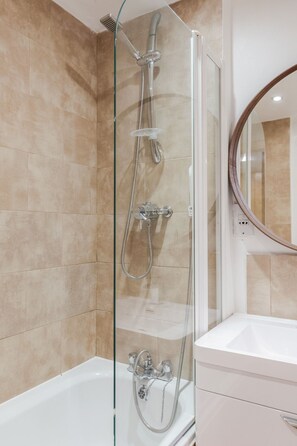 Combined shower/tub, hair dryer, towels, soap