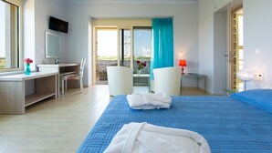A hotel room with a bed, a desk, a chair, a TV, and a balcony with a view. - Blue Mare Villa, privacy and relaxation! (Rethymnon)