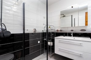Shower, hair dryer, towels, soap