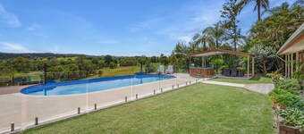 Country accommodation handy to town. Stunning rural views overlooking pool.