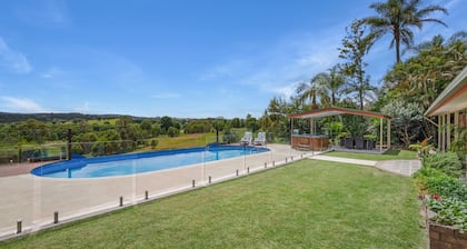 Country accommodation handy to town. Stunning rural views overlooking pool.