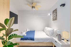 Desk, iron/ironing board, travel crib, bed sheets