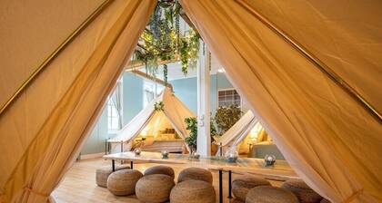 Experience Stay at the Glamping Loft Lake Geneva |Group Stays |Stylish Tent Suites |Kitchen & Bar