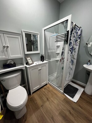 Shower, hair dryer, towels, soap