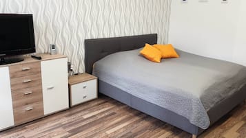 1 bedroom, desk, iron/ironing board, travel crib