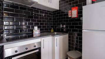 Fridge, microwave, stovetop, coffee/tea maker