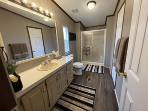 Combined shower/tub, hair dryer, towels, toilet paper