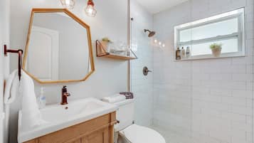 Shower, hair dryer, towels, shampoo
