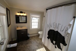 Bathtub, hair dryer, towels