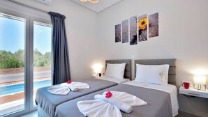 A hotel room with two beds, a large window, a pool view, and artwork on the wall. - Villa Ventus Sleeps 7 With Parking (Corfu)