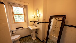 A bathroom with a toilet, sink, and shower. - Gorgeous Beacon Hills Studio next to State house (Boston)