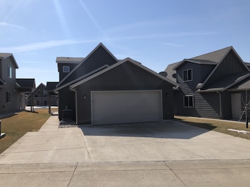 2 car garage with extra wide driveway for additional parking