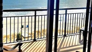 A balcony with a view of the ocean and beach. - Serenity by the Sea. Oceanfront. (Myrtle Beach)