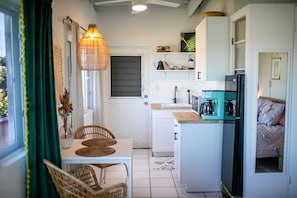 Fridge, microwave, coffee/tea maker, cookware/dishes/utensils