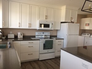 Fridge, microwave, oven, stovetop - Main Floor (Unit 1) in House, Deck, Sunset, Water View (Cheticamp Harbour) (Chéticamp)