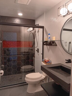 Shower, hair dryer, towels, toilet paper