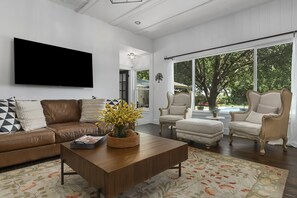Flat-screen TV, fireplace, ping pong, music library
