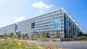 A modern building with a grid-like facade and reflective glass windows. - Sanya Discovery Ocean World (Sanya)