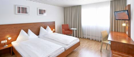 Standard Double or Twin Room | Down comforters, in-room safe, desk, free WiFi