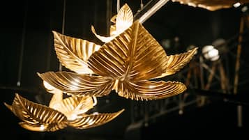 A chandelier with leaf-shaped light fixtures.