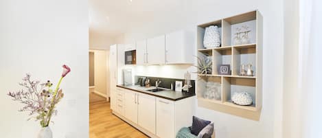 Fridge, microwave, cookware/dishes/utensils, spices