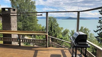 Enjoy al fresco dining and take in the serene views of the surrounding waters from this deck with a barbecue grill and fireplace.