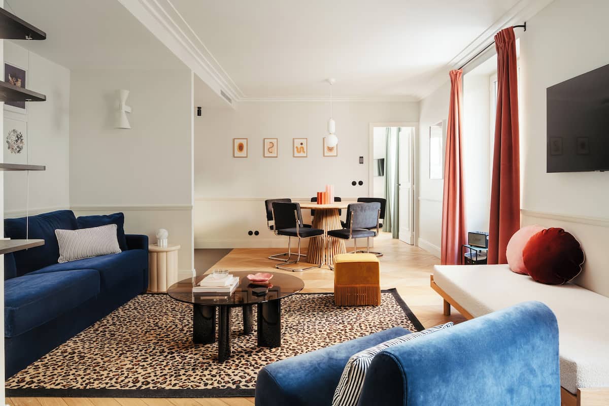1-BR Deluxe Apartment | Living area | 43-inch Smart TV with cable channels, TV