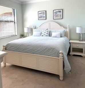 A bedroom with a bed, two bedside tables, a window with blinds, and two wall-mounted pictures. - Treviso Bay 3rd Floor Acqua Ct. Condo Corner Unit with TPC Golf (Naples)
