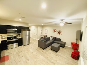Enjoy a comfortable stay in this well-appointed living space with a fully equipped kitchen and cozy seating area.