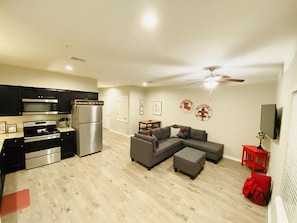 Enjoy a comfortable stay in this well-appointed living space with a fully equipped kitchen and cozy seating area.