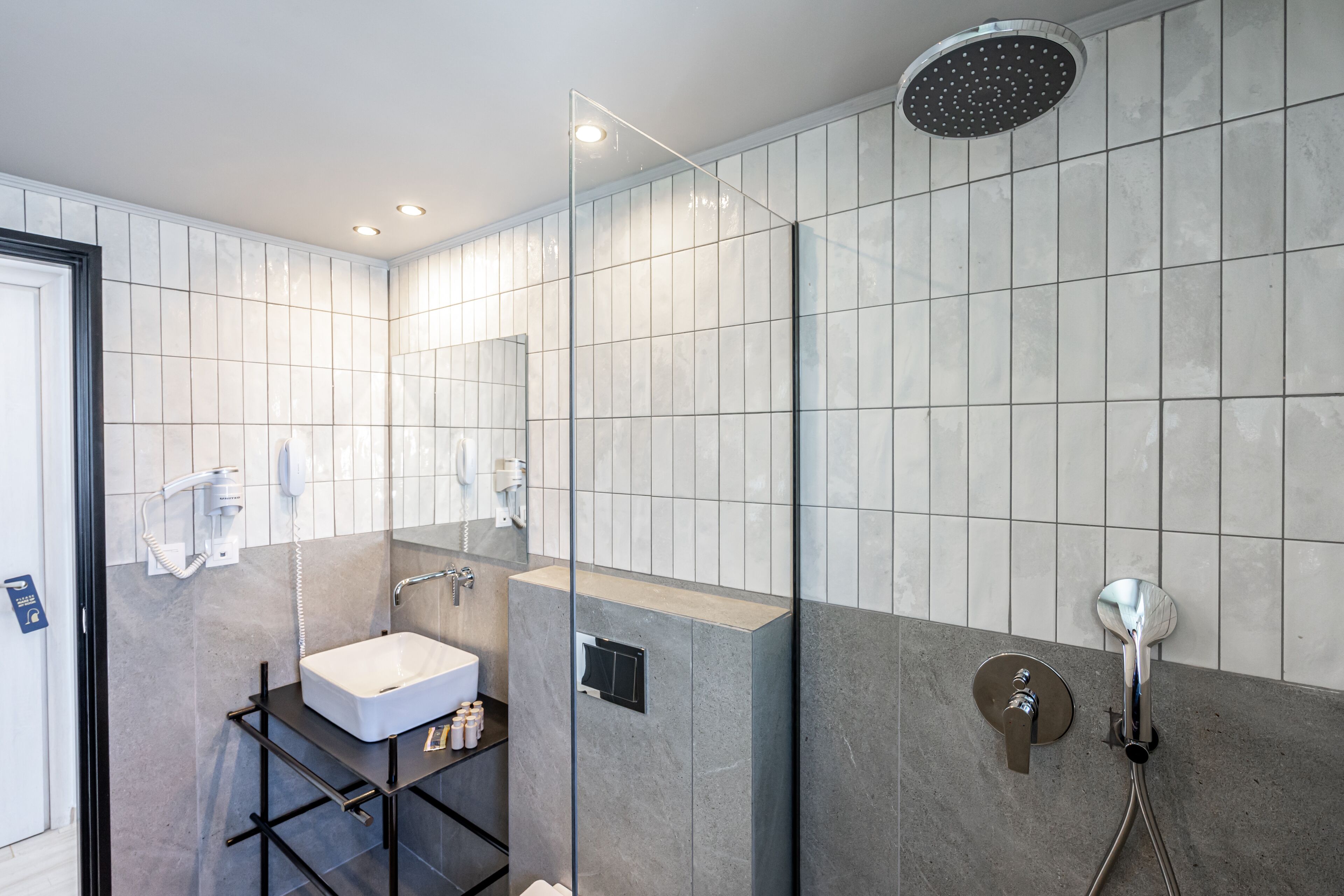 shower, rainfall showerhead, hair dryer, towels