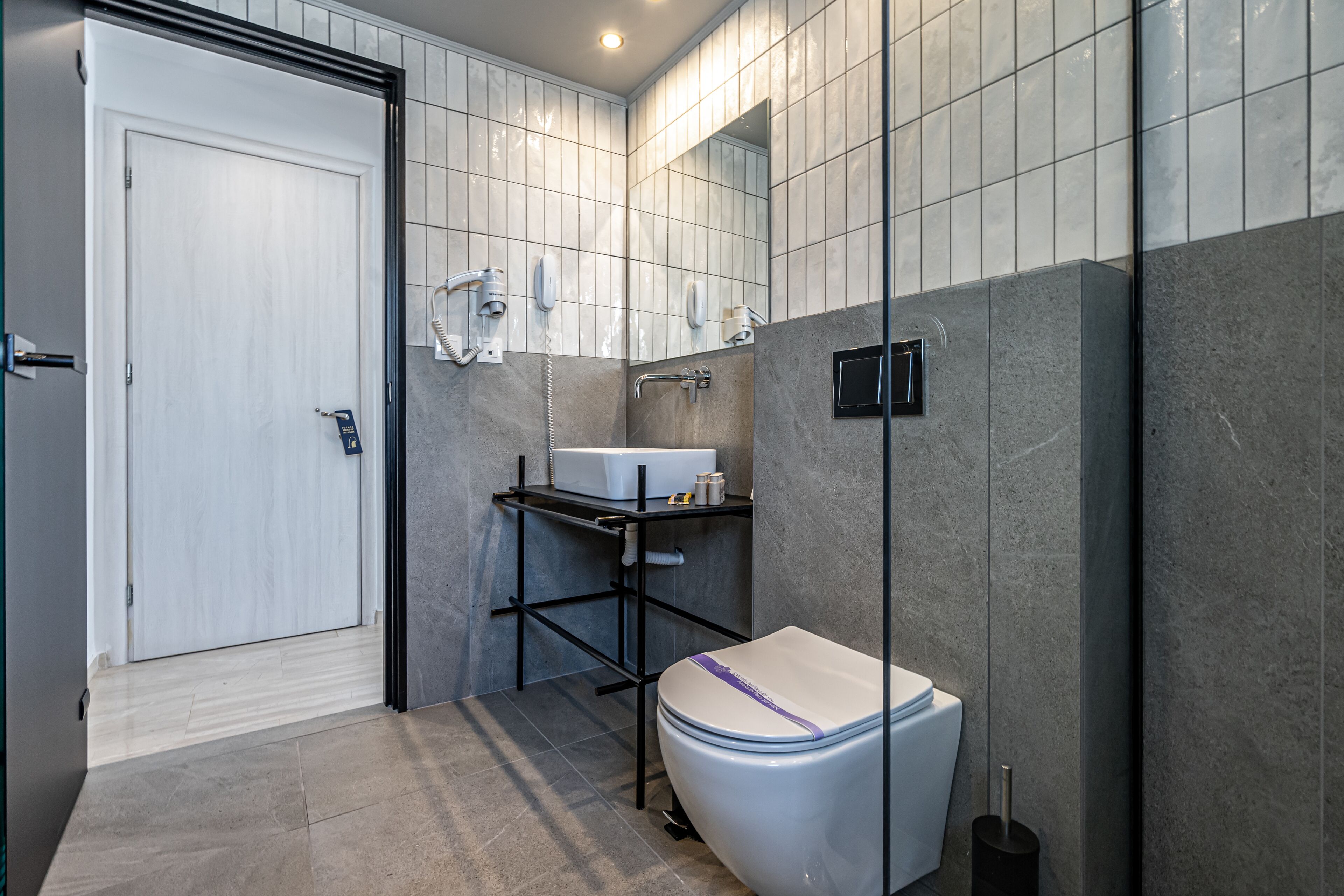 shower, rainfall showerhead, hair dryer, towels