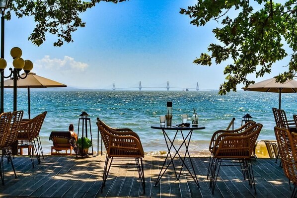 On the beach, white sand, sun loungers, beach umbrellas - Lepanto Beach (Nafpaktos)