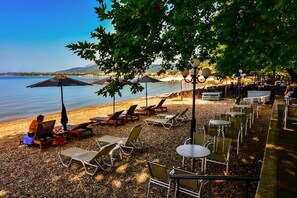 On the beach, white sand, sun loungers, beach umbrellas - Lepanto Beach (Nafpaktos)