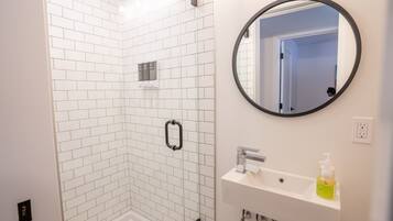 Shower, hair dryer, towels, toilet paper
