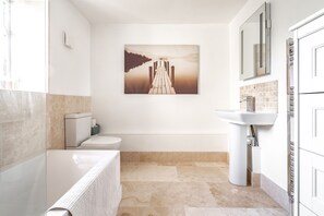 Combined shower/tub, hair dryer, towels, soap