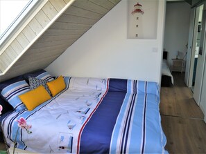 1 bedroom, desk, iron/ironing board, travel crib
