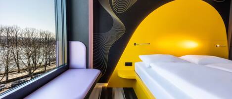 Hypo-allergenic bedding, desk, laptop workspace, blackout curtains