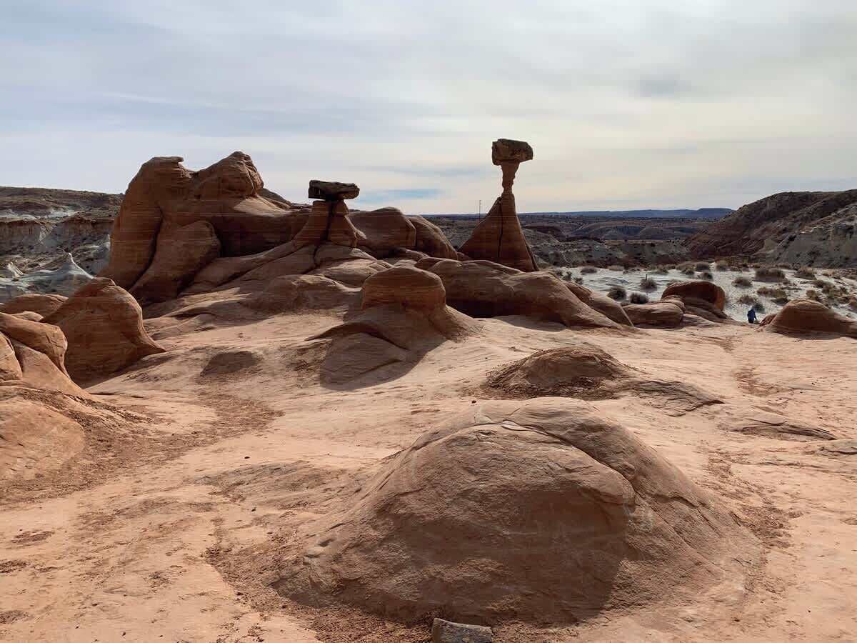 A desert landscape with prominent rock formations.