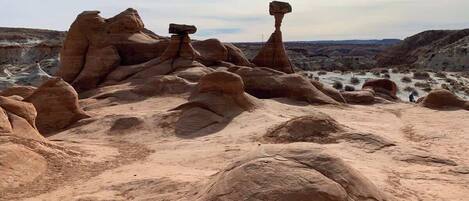 A desert landscape with prominent rock formations.