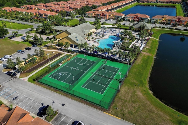 Pickle ball, tennis and basketball courts next to the clubhouse and pool.