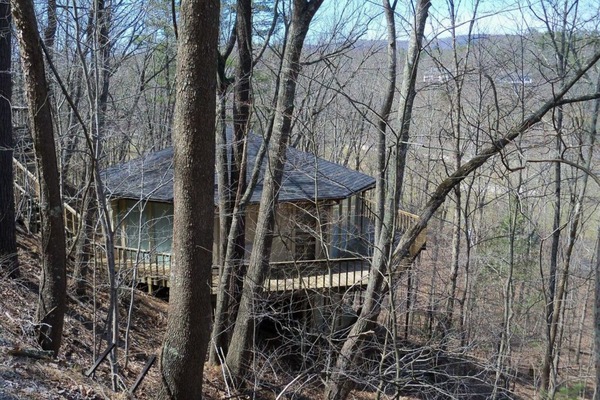 A unique octagon cabin, tucked into the side of the mountain.