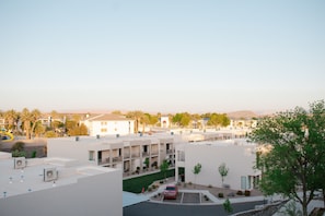 Residents can enjoy outdoor seating areas, a playground, and parking on site.